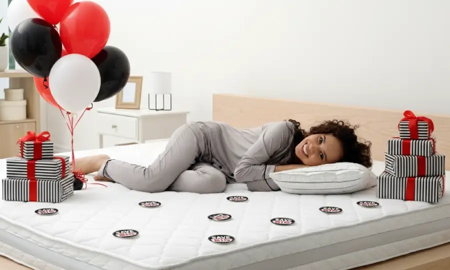 Attractive lady laying on a new, comfy mattress she bough during Black Friday sale
