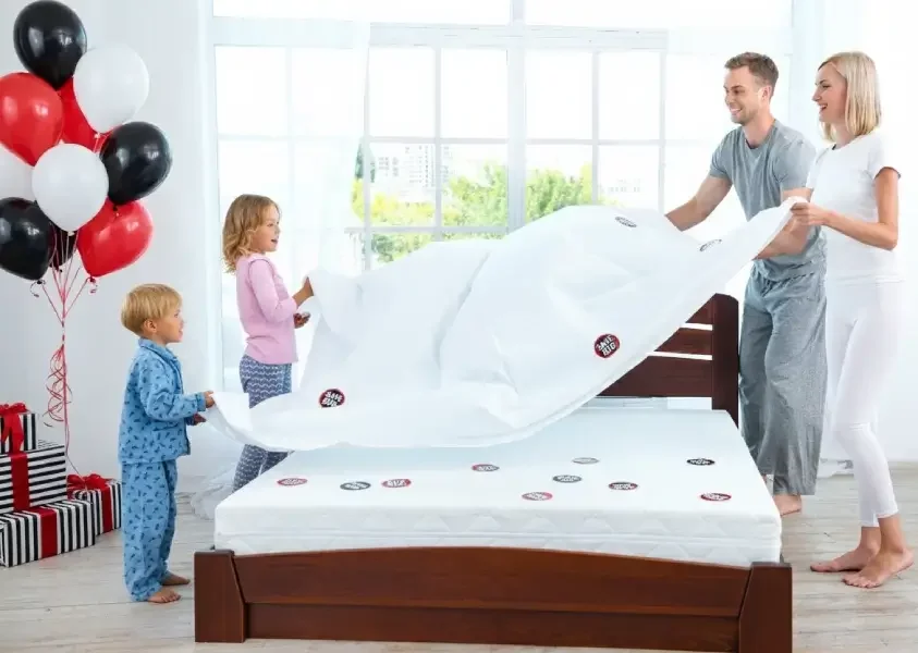Black Friday Affordable Mattress Article Happy family setting up cheap mattress