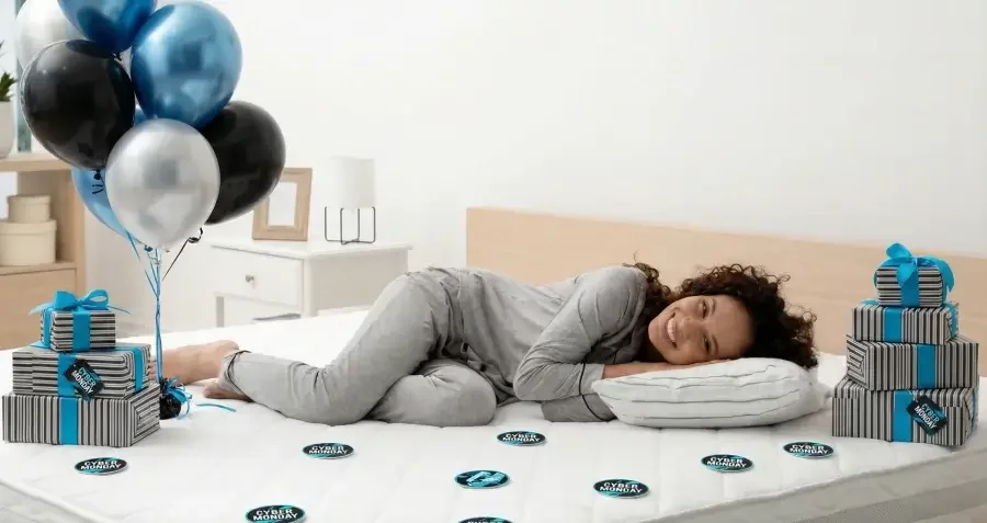 Attractive lady laying on a new, comfy mattress she bough during Black Friday sale