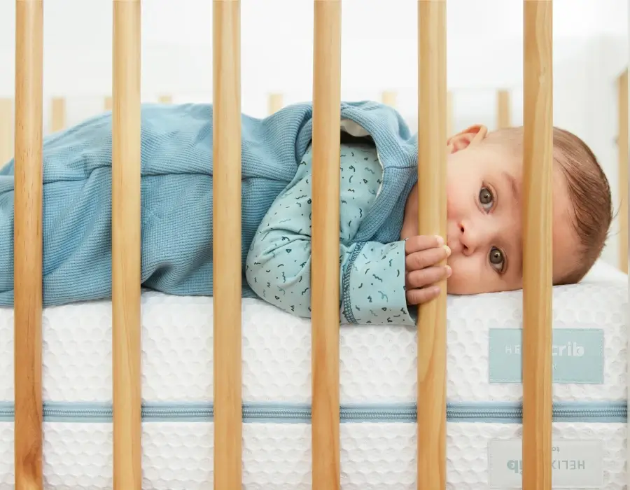 Helix Cribs baby in bed