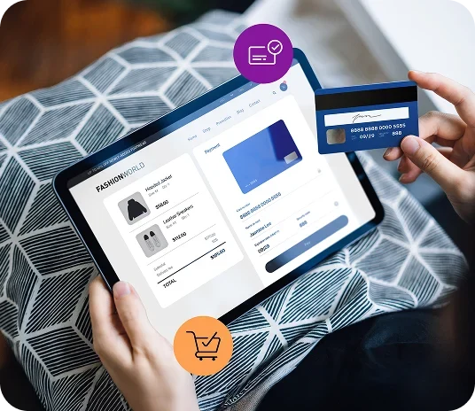 A close-up view of an online checkout process for Globalpayments image for article 1.webp, showing a person holding a tablet with an e-commerce store payment screen while another hand holds a blue credit card to enter payment details, featuring purple card-success and orange shopping-cart graphic icons