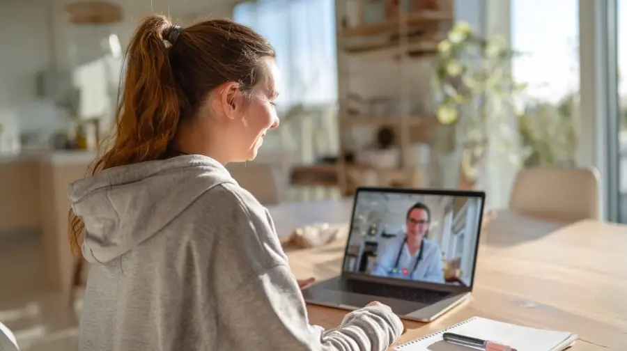 A young woman on a telehealth call with her doctor about GLP-1s
