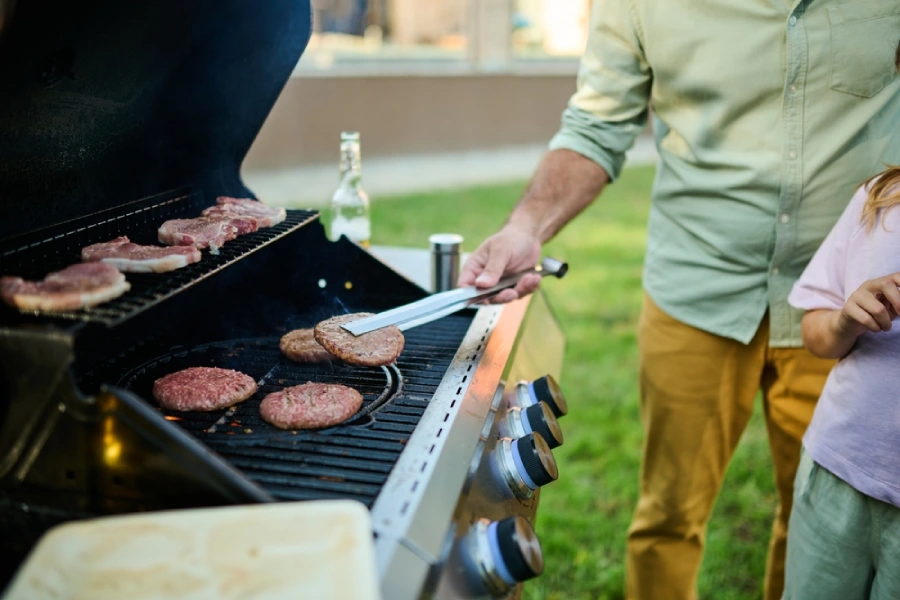 father and child grilling