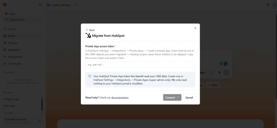 Base44 integration modal screen titled "Migrate from HubSpot" with a text input field requesting a HubSpot Private App access token.