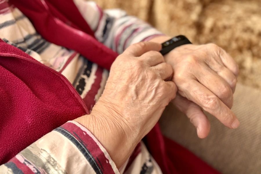 senior woman with a smart watch device medical