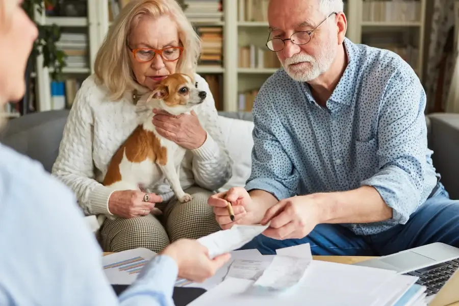 A couple with their dog at the vet's office